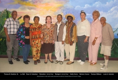 older adult volunteers in front of tropical mural at Long Beach Senior Center